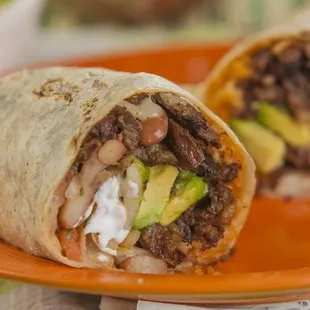 Super Burritos: choice of meat, , monterey cheese, whole beans, rice, pico de gallo, avocado, sour cream and salsa.