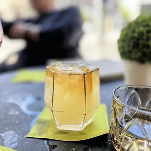 a glass of wine and a glass of whiskey