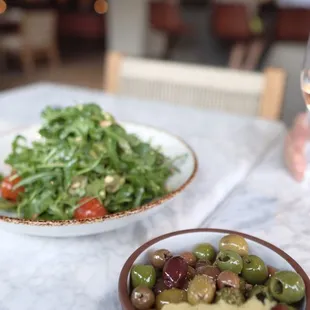 Warm Olives,  arugula salad