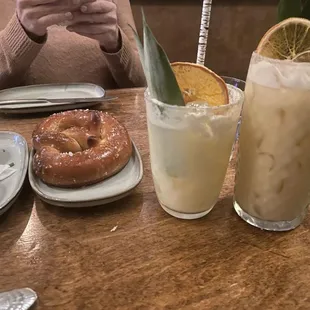 Pretzel with extra cheese, alcoholic and non-alcoholic Painkiller