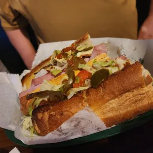 a sub sandwich in a basket