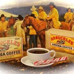 a cup of coffee and a box of arbuckles