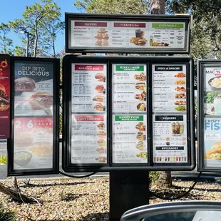 a menu board and a car