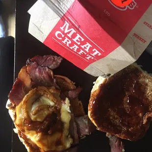 Brisket sandwich, with mayonnaise wiped off, half piece of cheese with 1 onion straw on a soggy sauce soaked bun. Yum