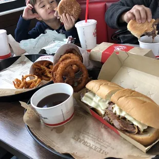 French Dip Sandwich, My grandson admires his Jr Roast Beef Sandwich.