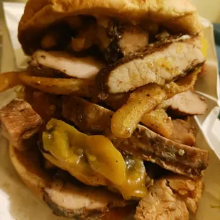 a sandwich with meat and cheese