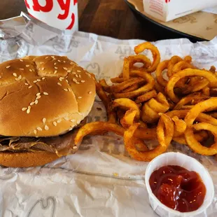 a hamburger, fries and ketchup