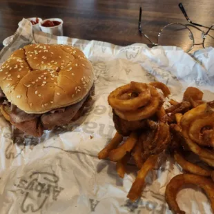 a hamburger and onion rings