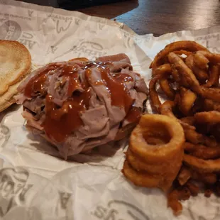 a sandwich and onion rings