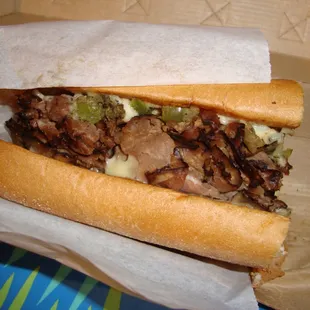 a sandwich with meat and cheese