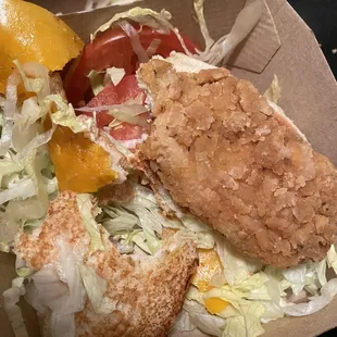 a sandwich and salad in a box