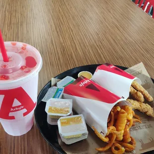 Chicken tenders meal with curly fries