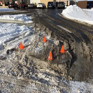 orange cones in the snow