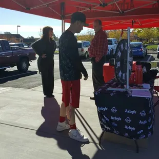 Spin and win prizes wheel outside on Grand Opening day
