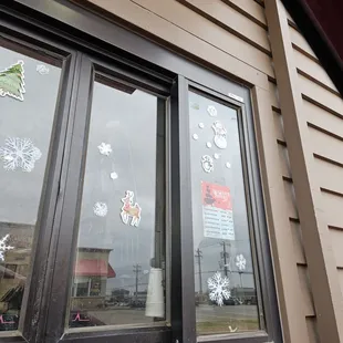 snowflakes on the windows of a restaurant