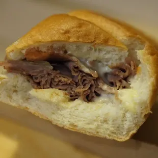 a beef sandwich cut in half