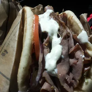 a sandwich with meat and vegetables