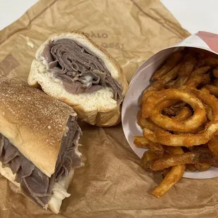 a sandwich and onion rings