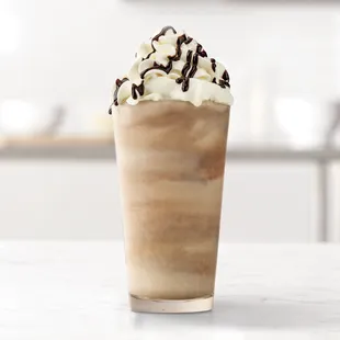 a cold drink with whipped cream and chocolate