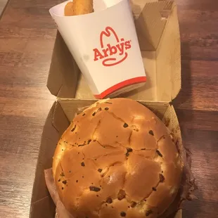 a hamburger and fries in a box