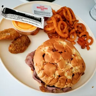 Beef and Cheese classic.  Delicious.  Thinly sliced.  Soft bun. Jalapeño Popper and curly fries.