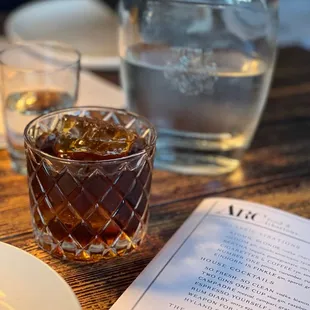 Whiskey - sorry can't remember the name but it was amazing. Just show the picture. It's a popular drink so they will know.