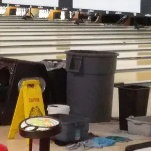 Big bucket to catch water and towels to soak up water on floor