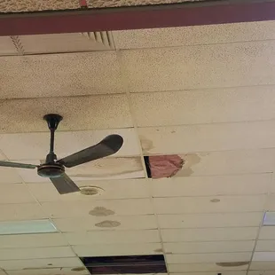 Ceiling wires exposed, celing tiles falling down