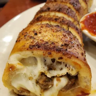 Pepperoni, sausage and bacon Stromboli