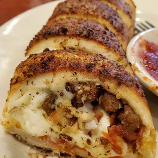 Pepperoni, sausage and bacon Stromboli
