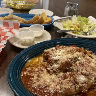 Stuffed peppers with side salad and garlic bread
