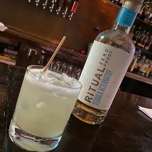 a bottle of rum and a glass of rum