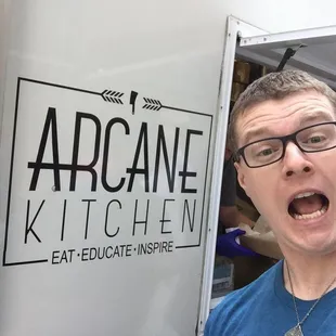 a man opening the door of a food truck