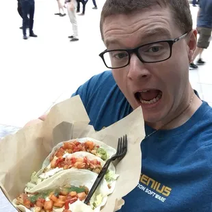 a man holding a plate of food