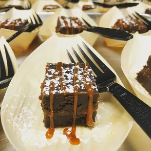 a plate of brownies with caramel drizzle