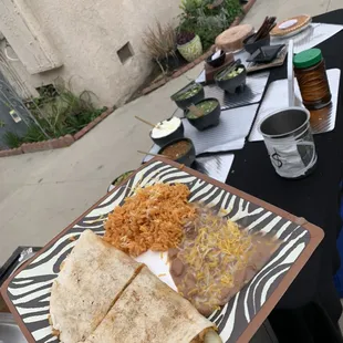 Loaded chicken quesadilla with rice and beans