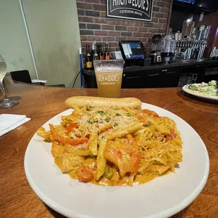 a plate of pasta with shrimp
