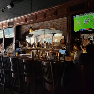 a bar with a large screen tv