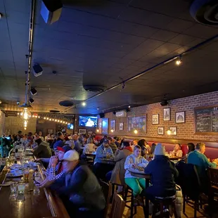 a large group of people sitting at tables