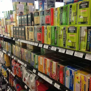 a variety of teas on a shelf