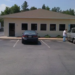 two cars parked in a parking lot