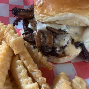 Double mushroom and Swiss smash burger with crinkle cut fries