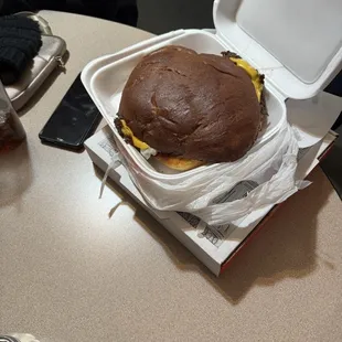 Their super smash burger with four patties. Surprised they weren&apos;t stacked but on a large bun.