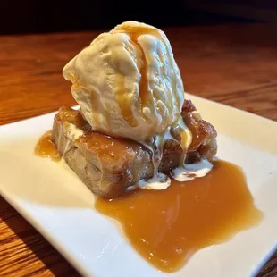 a dessert with ice cream and caramel