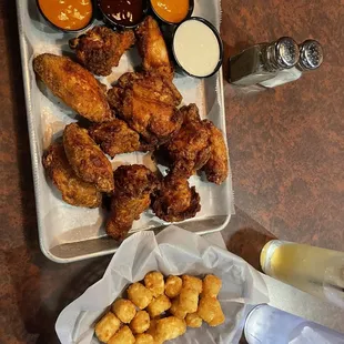 Wing flight, sexy style, gochujang, and wing&amp; a prayer sauce.