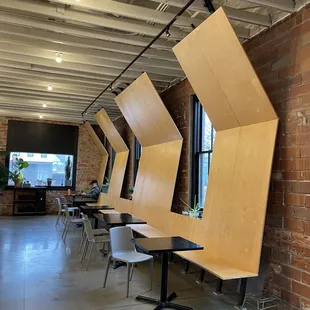 a row of tables in a coffee shop