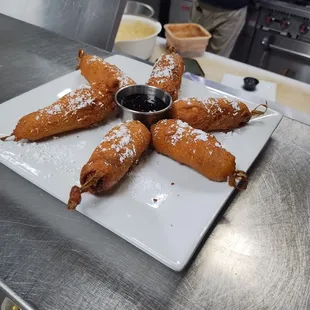 These are the pigs in a blanket ideep fried pancake batter. It's delicious!!