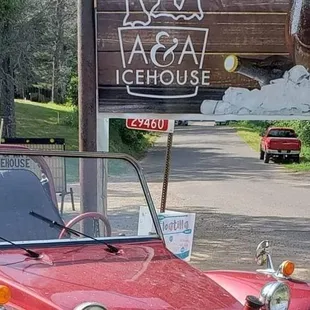 a red car parked on the side of the road
