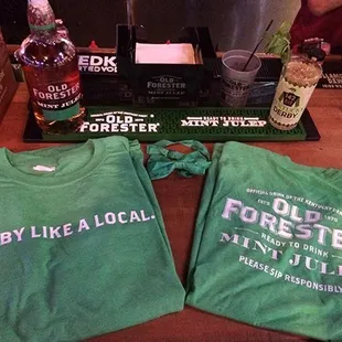 two t - shirts on a table
