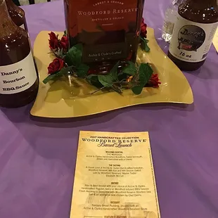 a bottle of whiskey and a menu